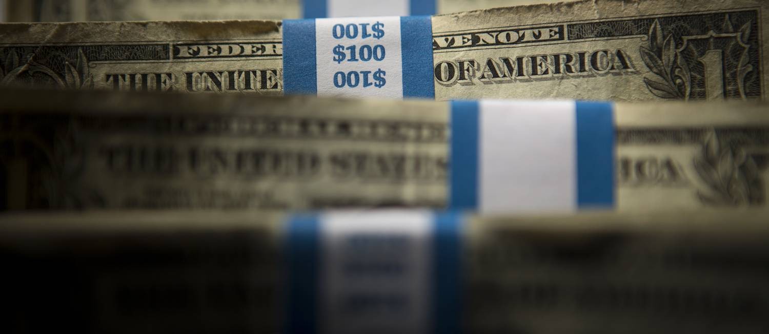 Pacotes com notas de US$ 1 Foto: Scott Eells / Bloomberg