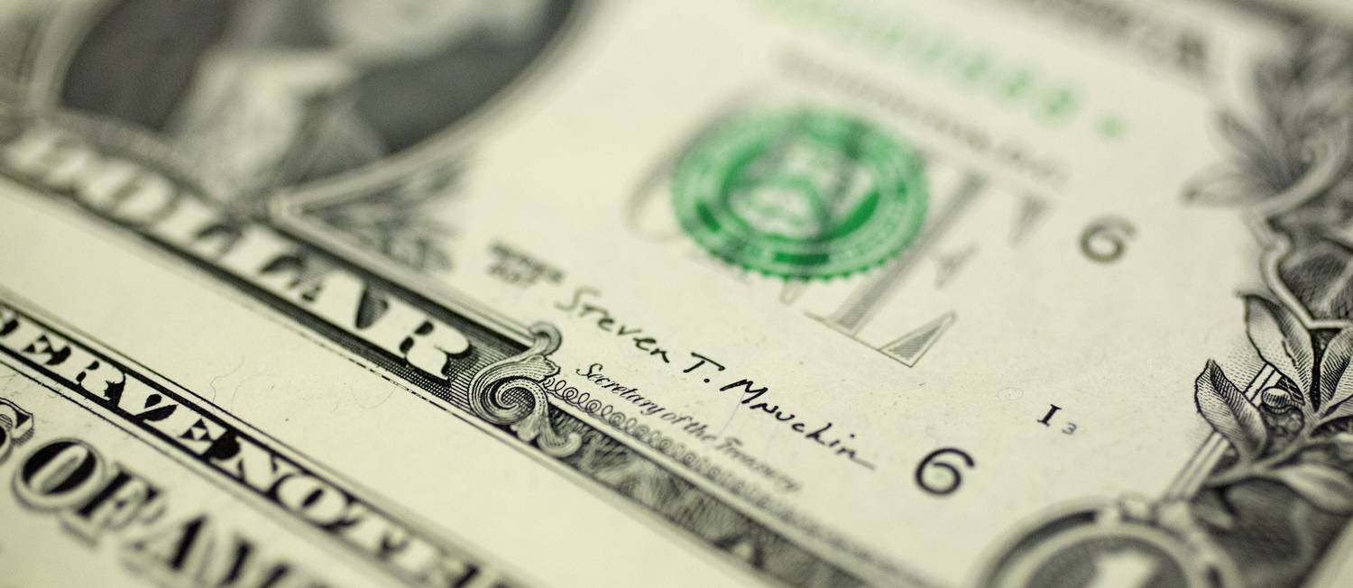 Detalhe de nota de dólar Foto: Andrew Harrer / Bloomberg