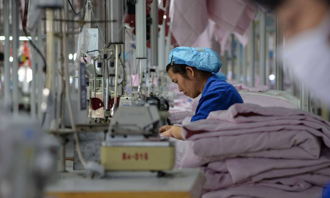 Trabalhadora chinesa de produtos manufaturados.
Foto: AFP