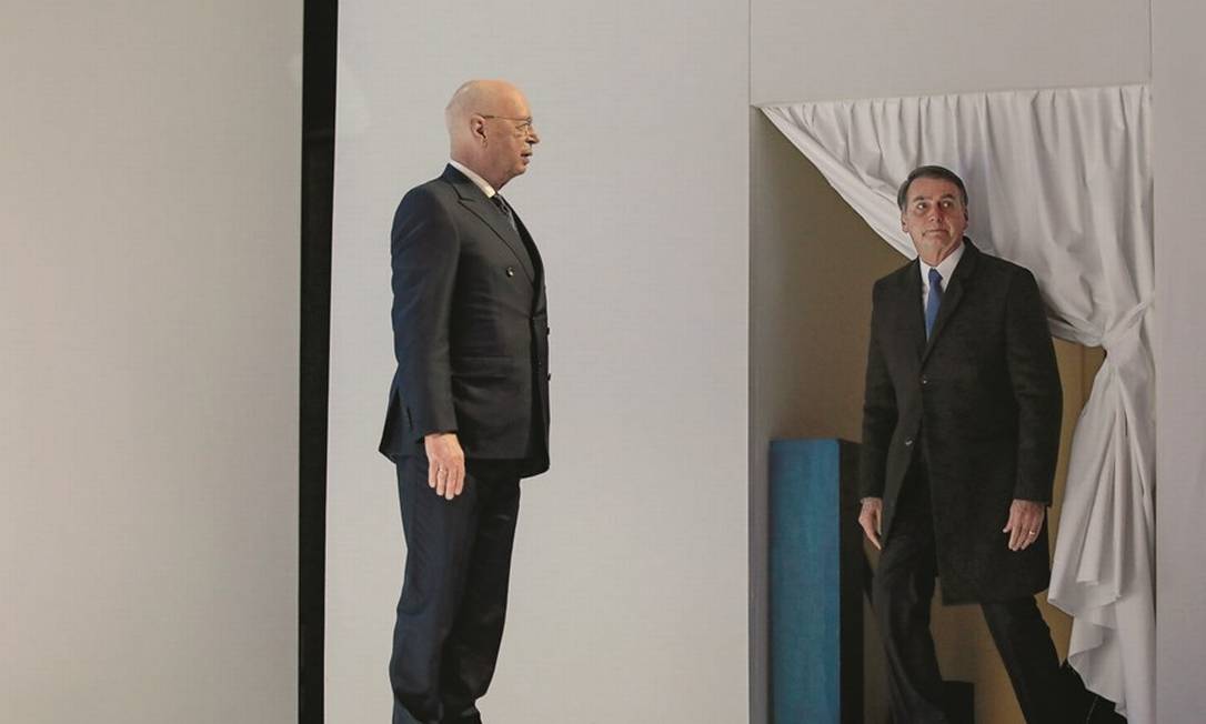 O presidente e criador do fórum, Klaus Schwab (à esquerda), ficou surpreso com a lista de convidados de Bolsonaro. Foto: Jason Alden / Bloomberg / Getty Images