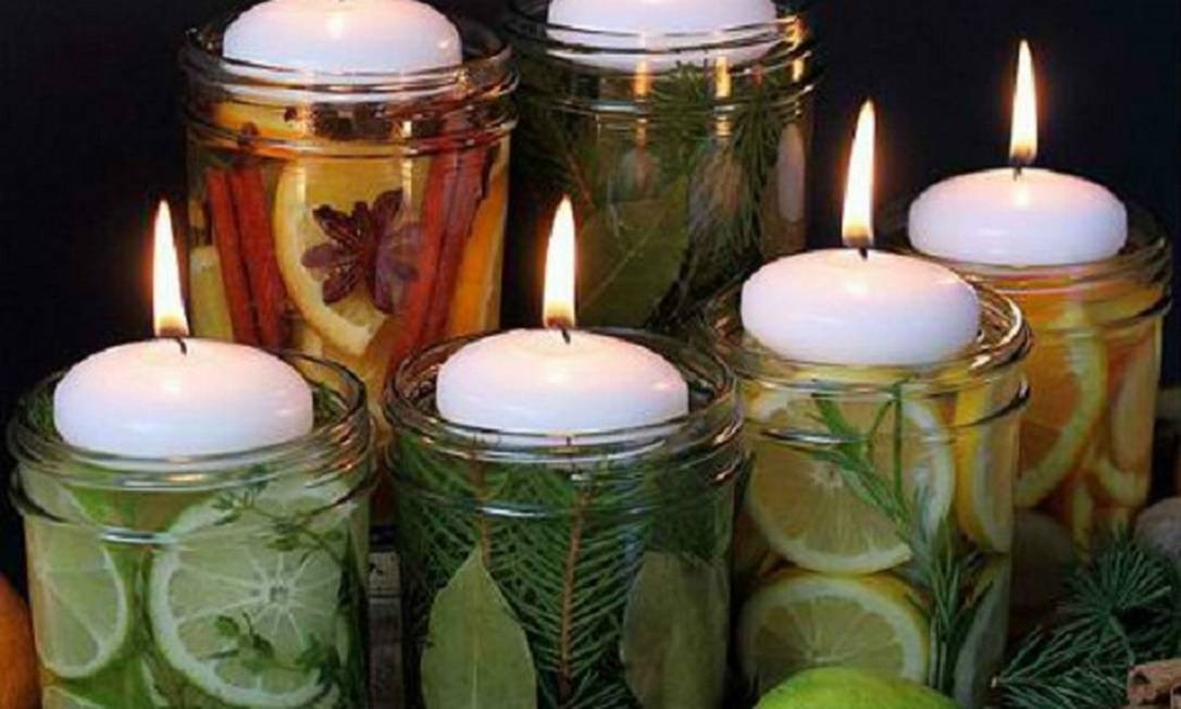 Imagem do dia: velas em potes com frutas - Jornal O Globo