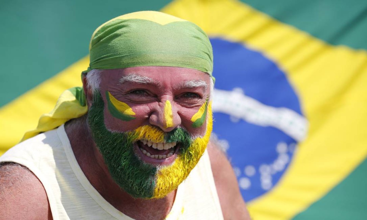 Os descontentes com o governo foram às ruas vestidos e pintados de verde e amarelo Foto: Pablo Jacob / Agência O Globo