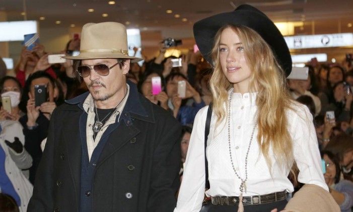 Johnny Depp e a mulher Amber Heard Foto: Shizuo Kambayashi / AP