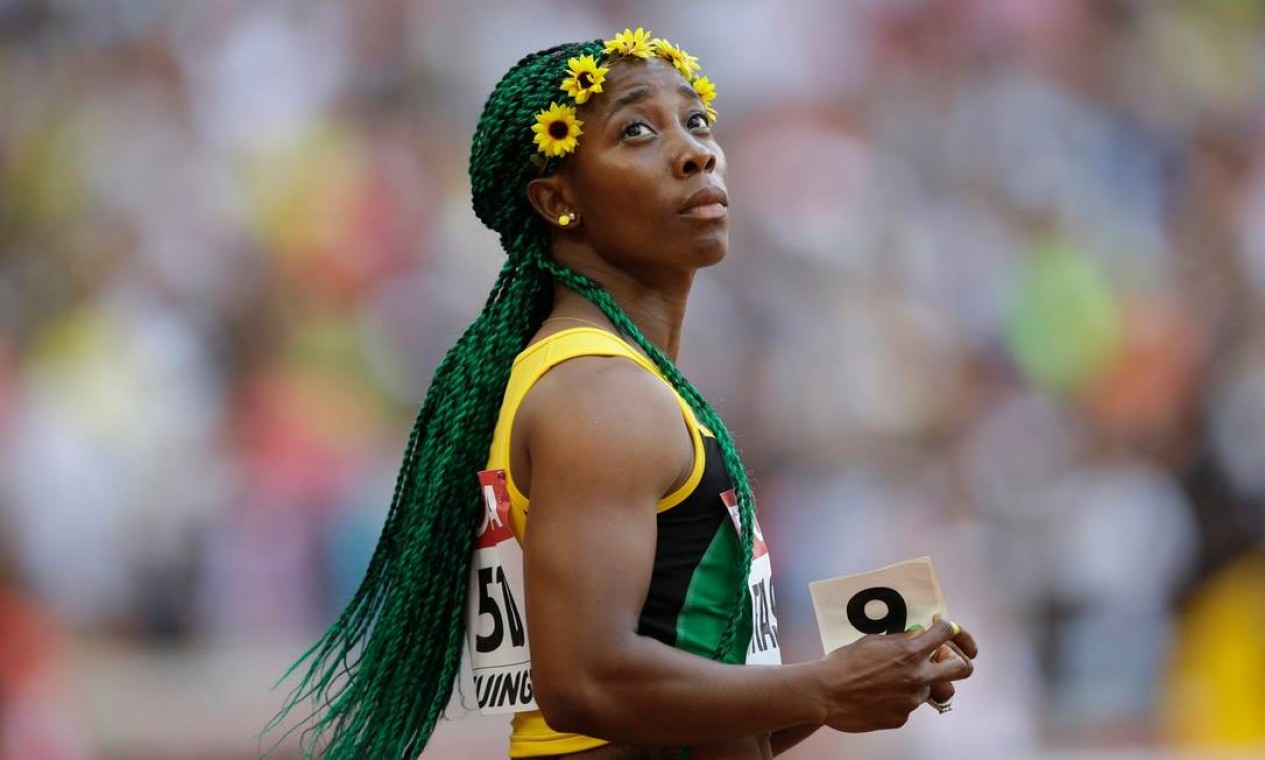 Atual bicampeã dos 100m, a velocista Shelly-Ann Fraser-Pryce vai carregar a bandeira da Jamaica Foto: Kin Cheung/AP