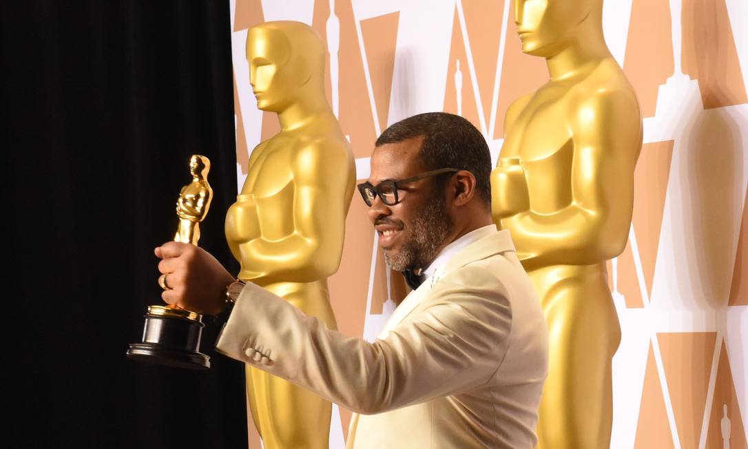 Jordan Peele ganhou o Oscar de roteiro original por 'Corra' Foto: ROBYN BECK / AFP