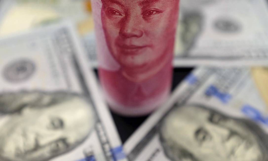 
Yuan X Dólar: mecanismo adotado pelo BC chinês tenta reduzir tensões com os EUA
Foto:
Jason Lee
/
REUTERS
