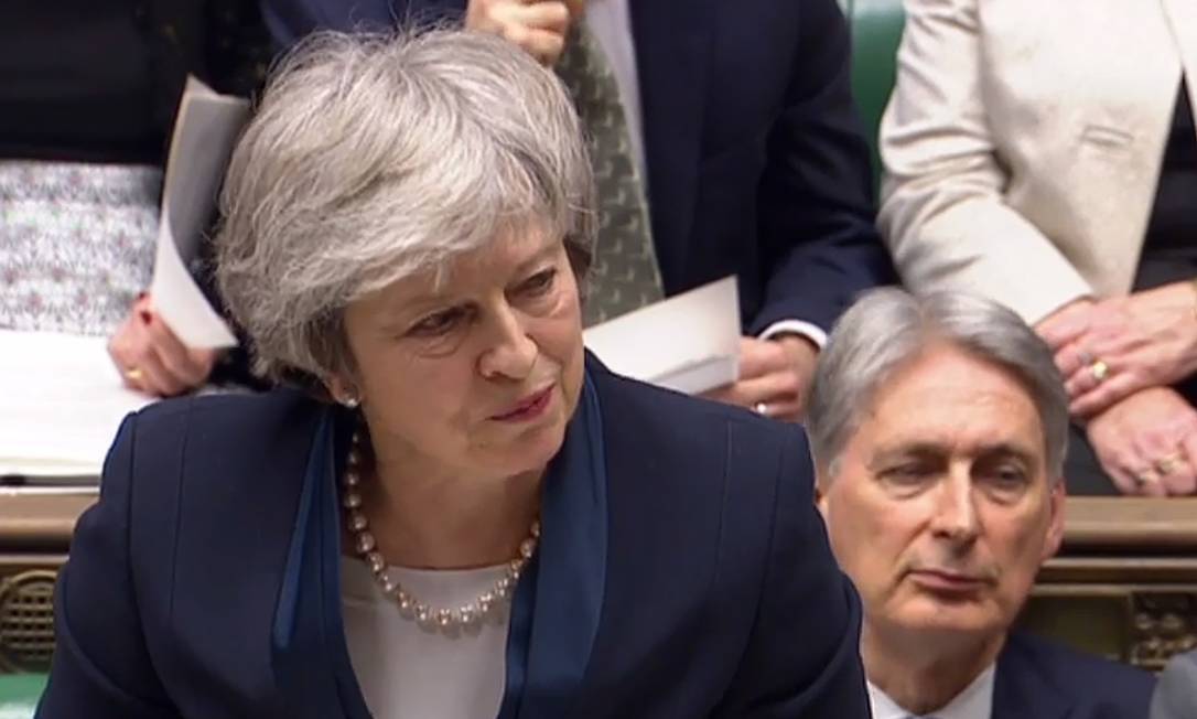 Premier britânica, Theresa May, durante sessão no Parlamento britânico Foto: HO / AFP