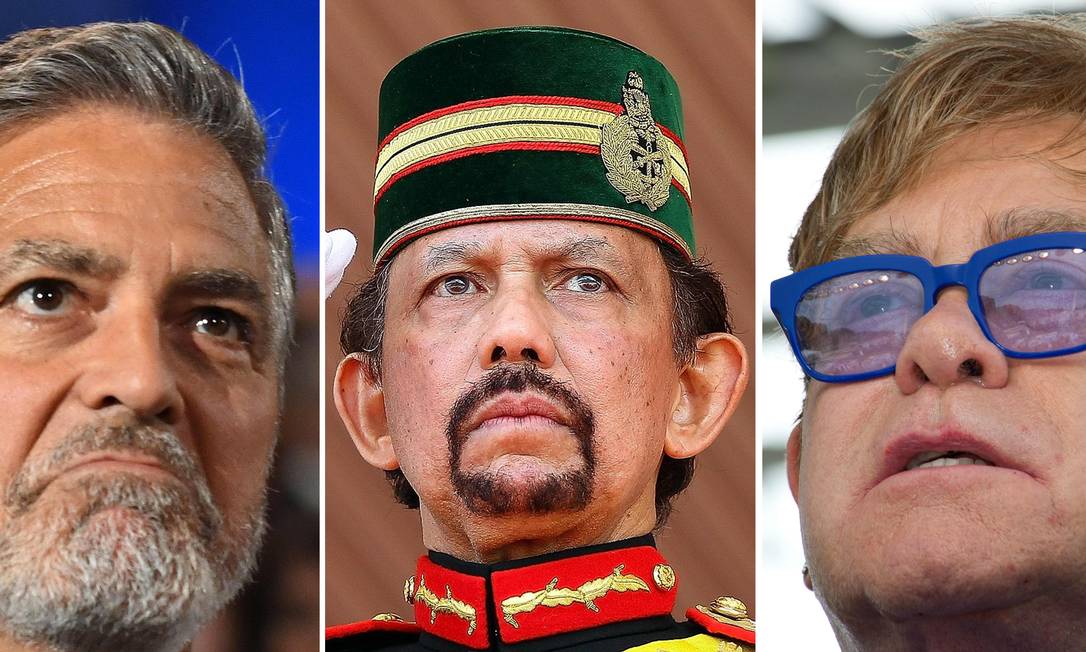 O ator George Clooney, o sultão Hassanal Bolkiah e o cantor Elton John: pena de morte contra homossexualidade foi anunciada em 2013, mas implementação foi adiada devido à oposição de grupos de direitos humanos Foto: AFP