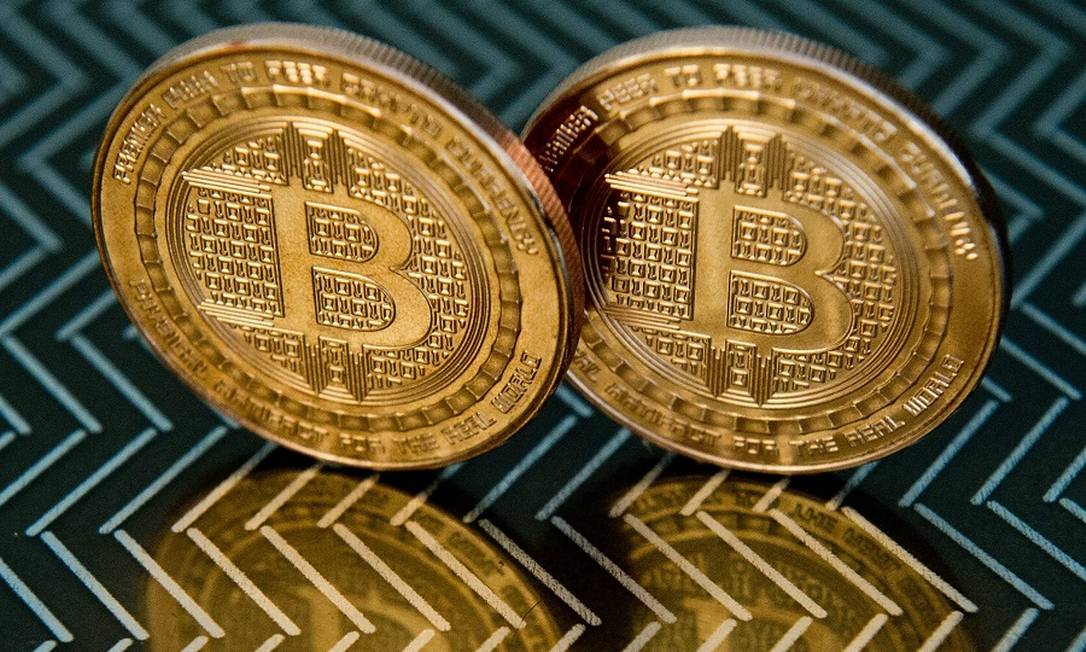 Bitcoins: mexidas num mercado de centenas de bilhões de dólares. Foto: KAREN BLEIER / AFP