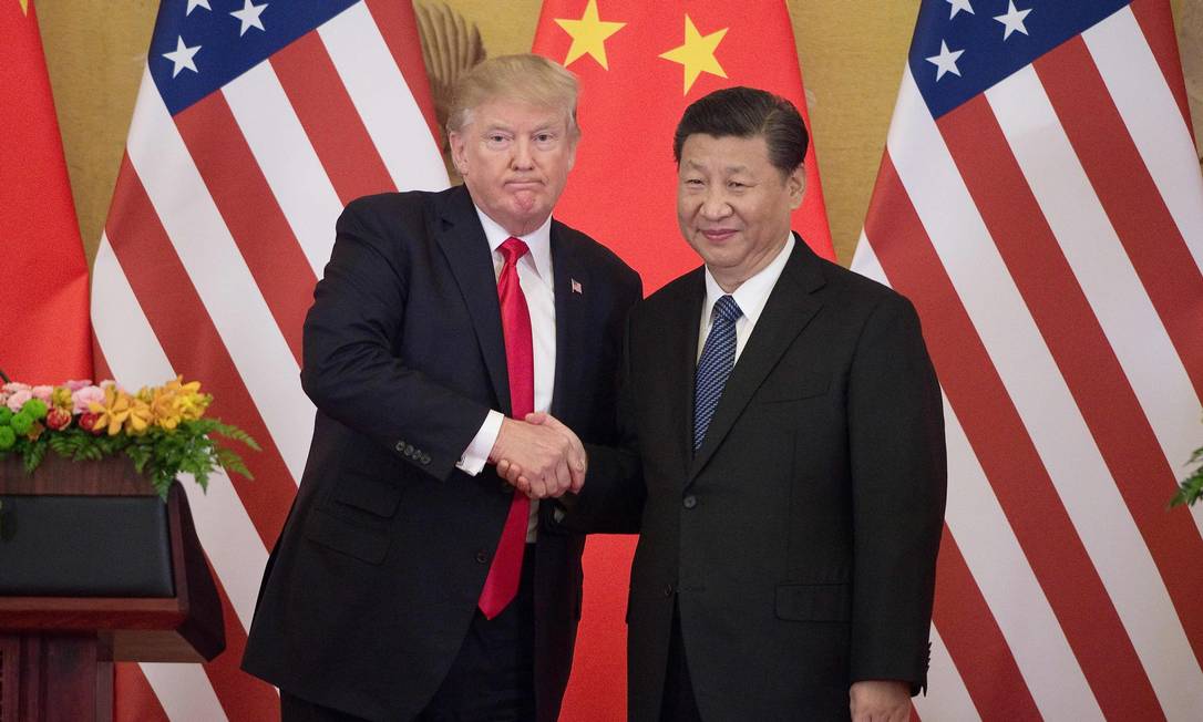 A assinatura da primeira parte do acordo comercial entre Washington e Pequim pode ajudar na recuperação da economia chinesa Foto: NICOLAS ASFOURI / AFP