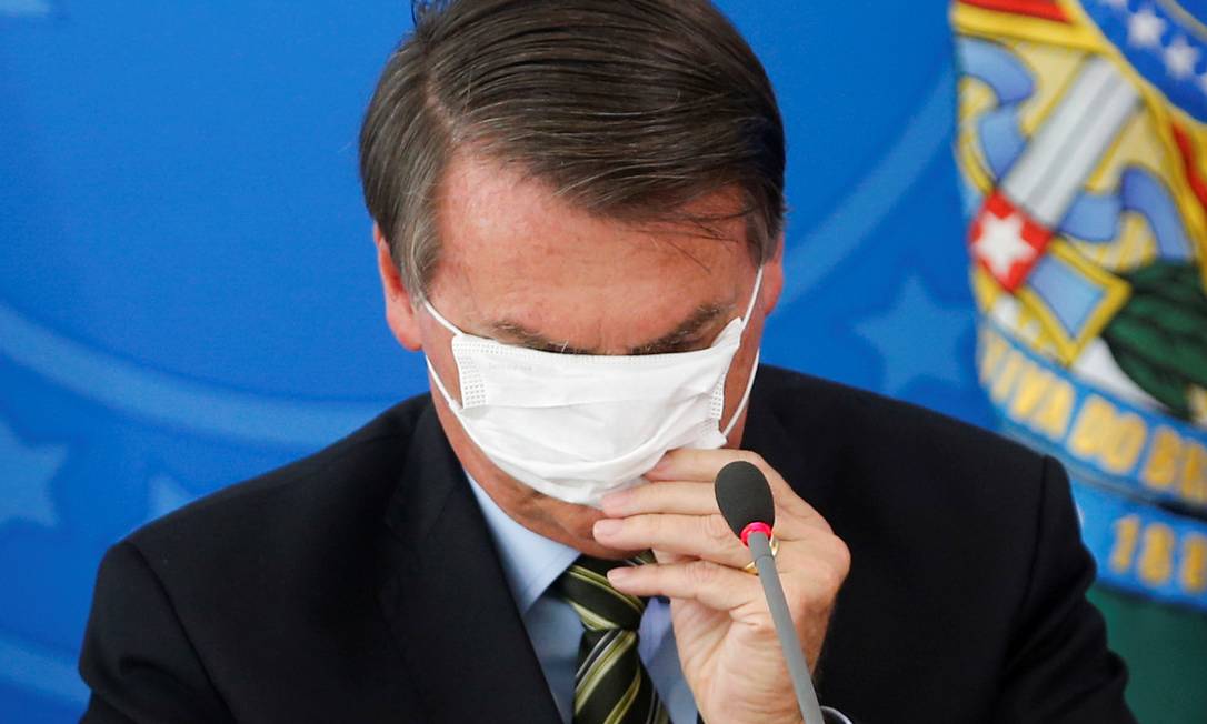 Presidente Jair Bolsonaro com máscara durante coletiva Foto: ADRIANO MACHADO / REUTERS
