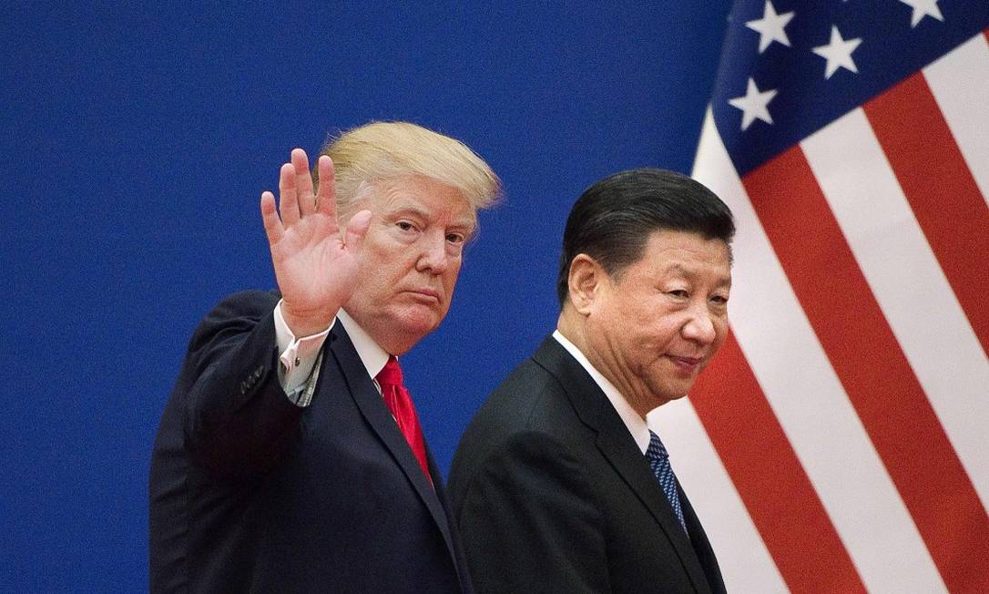 Donald Trump e Xi Jinping, durante visita do líder americano a Pequim Foto: NICOLAS ASFOURI / AFP / 9-11-2017