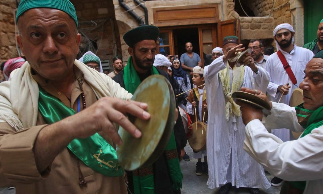 A group of Sufi Muslims celebrate a ritual to commemorate the birth of the Prophet Muhammad, known in Arabic as the holiday 