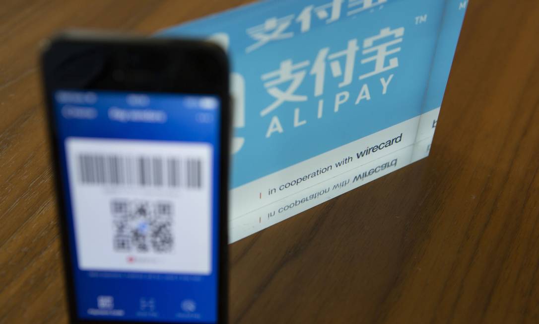 Compras no Taobao, do grupo Alibaba, só podem ser pagas com o Alipay, pertencente ao grupo Foto: Matthias Doering / Bloomberg