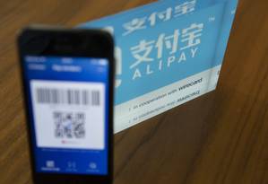 As compras no Taobao, do grupo Alibaba, só podem ser pagas com o Alipay, que pertence ao grupo Foto: Matthias Doering / Bloomberg