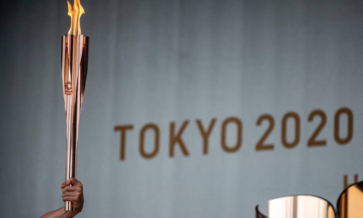 A tocha olímpica chega a Tóquio, Japão, para o primeiro dia do revezamento Foto: PHILIP FONG / AFP