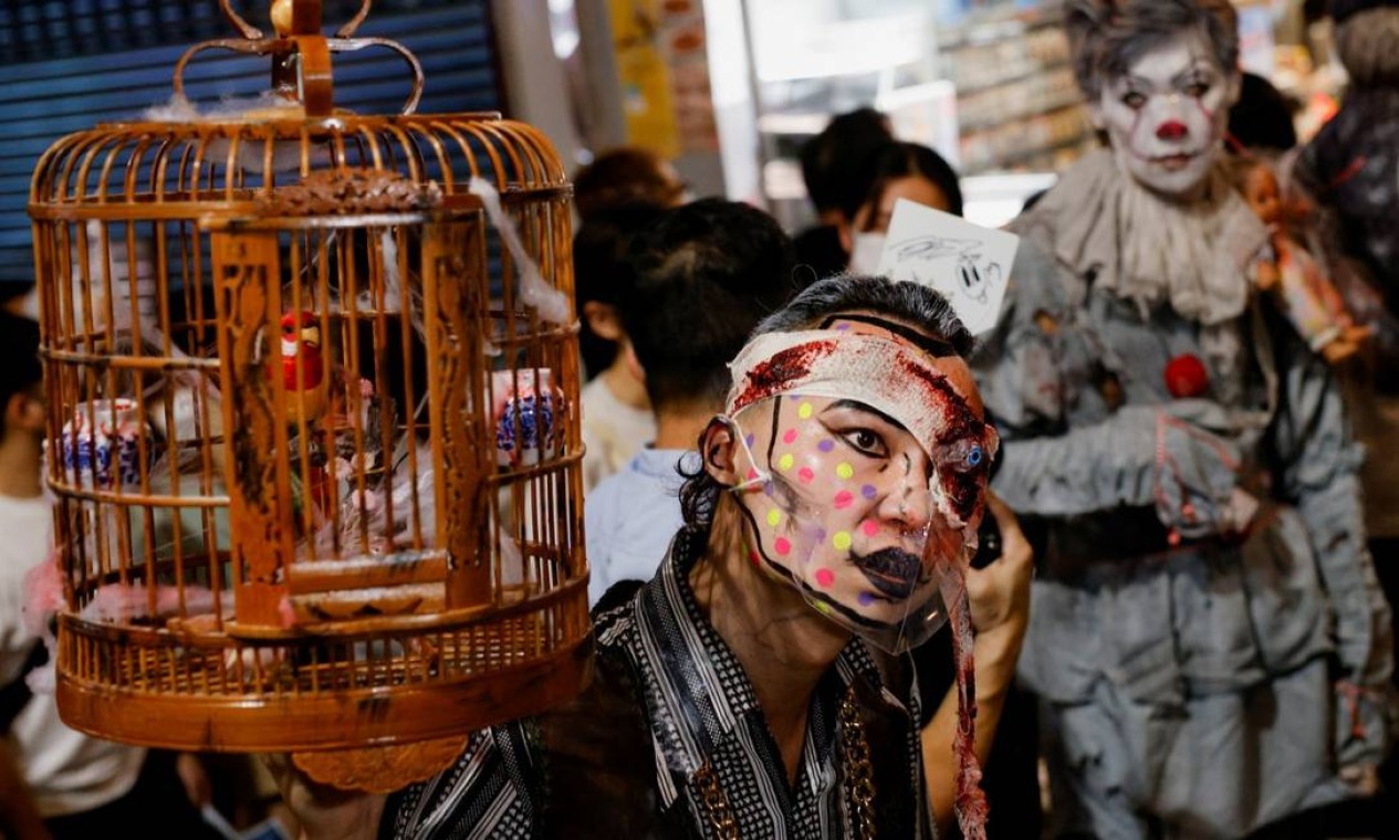 Folião em Hong Kong, China Foto: TYRONE SIU / REUTERS