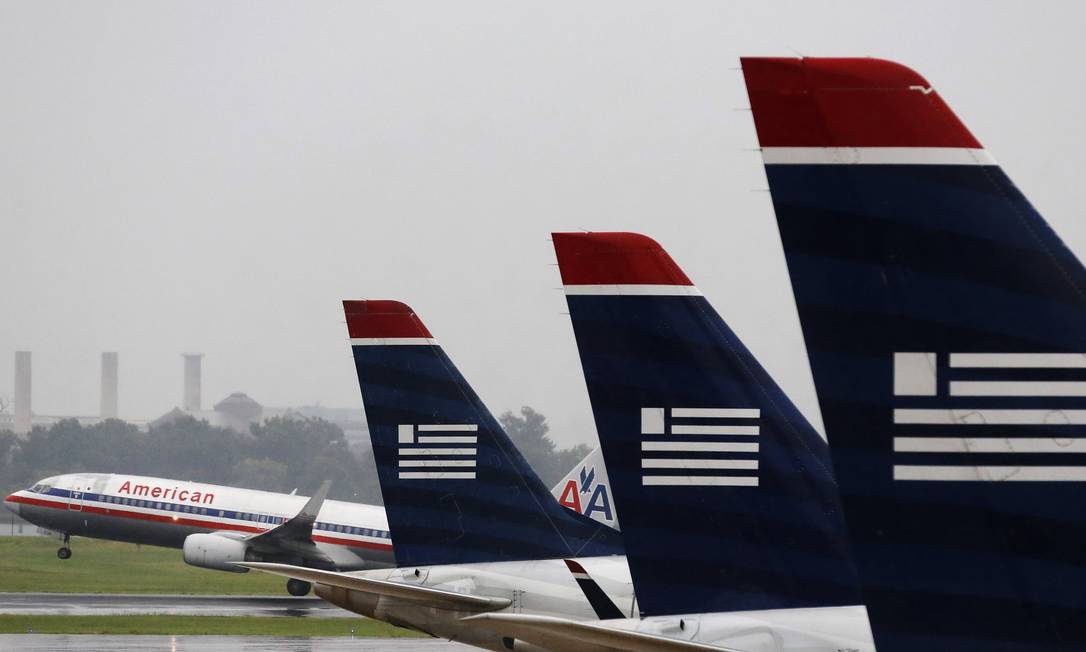 
Aviões da American Airlines no aeroporto de Washington: ‘Decolar.com vem utilizando práticas tarifárias desleais e pouco claras’
Foto: LARRY DOWNING / Reuters