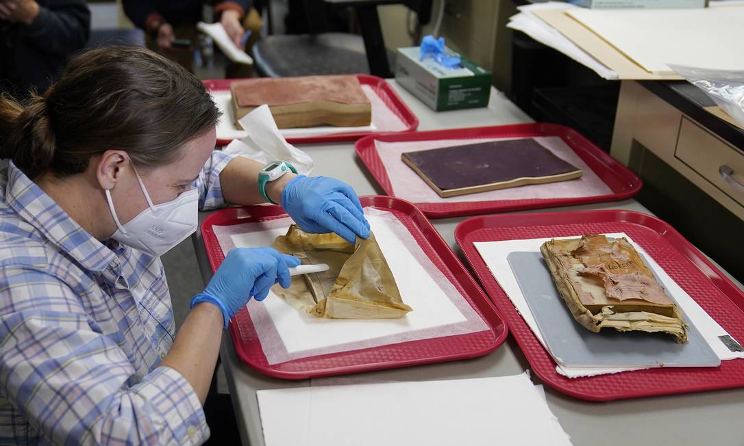 The Restorer Works on the Envelope Removed from the Time Capsule Photo: AP