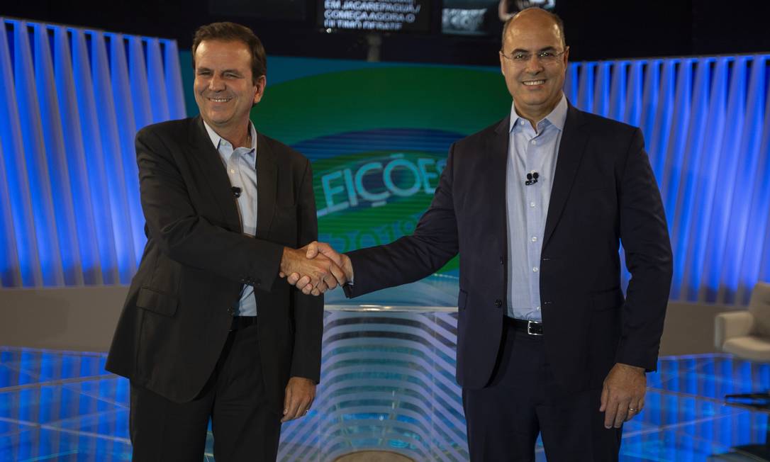 Eduardo Paes (DEM) e Wilson Witzel (PSC) durante debate na TV Globo Foto: Alexandre Cassiano / Agência O Globo